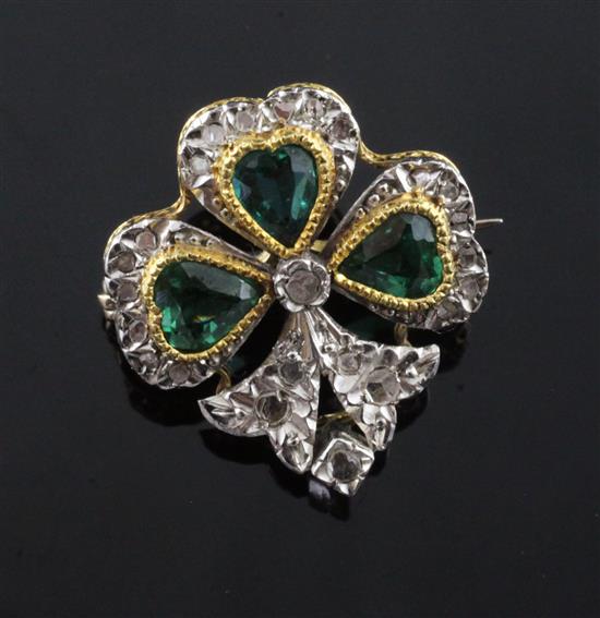 A gold and platinum, heart shaped green tourmaline and rose cut diamond set shamrock brooch, 20mm.